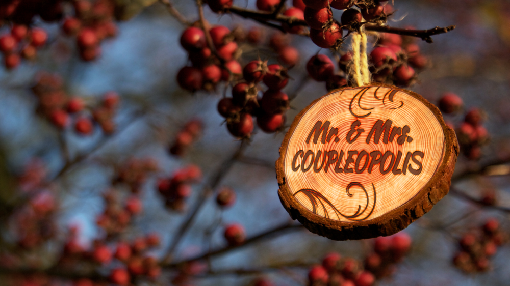 Crabapple tree with wooden log ornament displaying Mr. & Mrs. name.